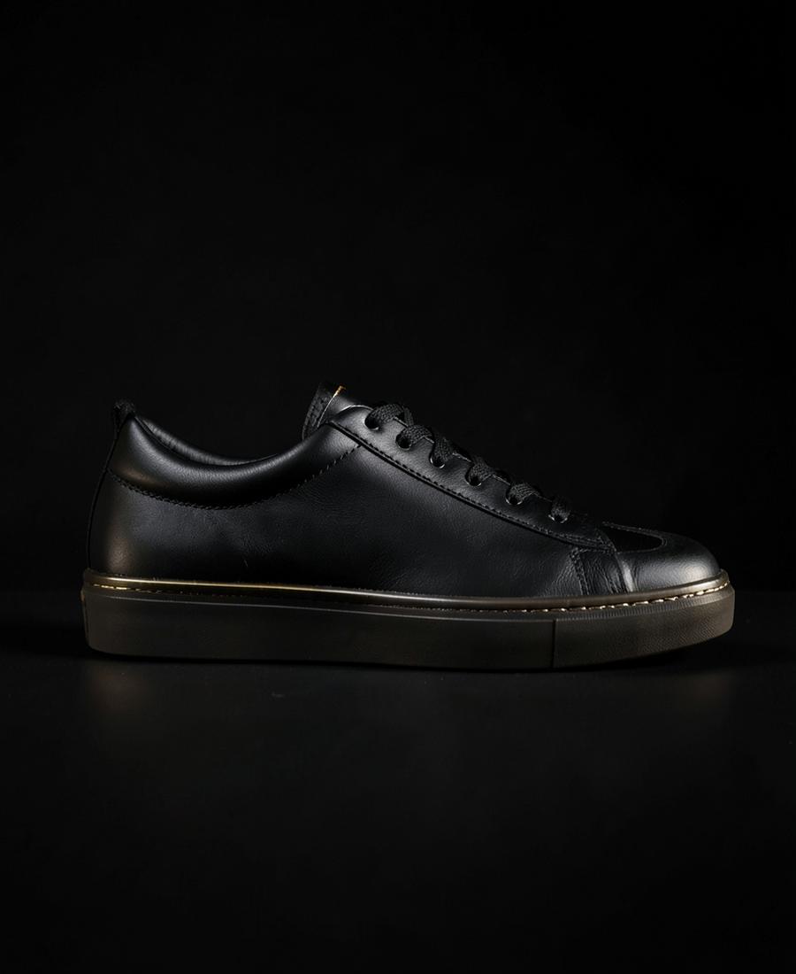 Onyx Low — Full-grain black leather, gold welt